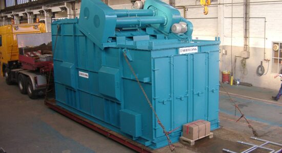 Light blue linear vibrating screen (as a hot mineral screening machine) ready for transportation on a heavy-duty truck.