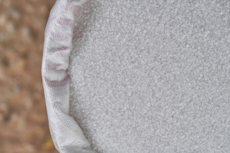 Ammonium sulphate nitrogen fertilizer crystals in bags for fertilizing plants