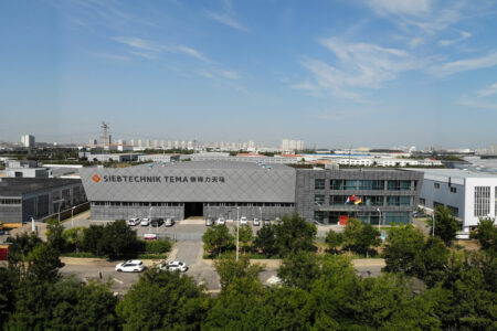 SIEBTECHNIK-TEMA Headoffice Wuqing, China Gray building with SIEBTECHNIK-TEMA logo