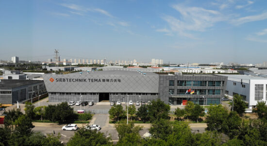 SIEBTECHNIK-TEMA Headoffice Wuqing, China Gray building with SIEBTECHNIK-TEMA logo